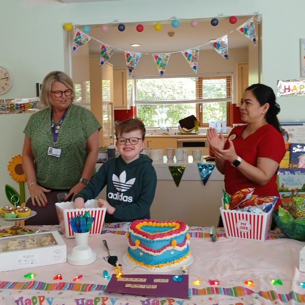 Cian cutting the LauraLynn 13th Birthday cake 