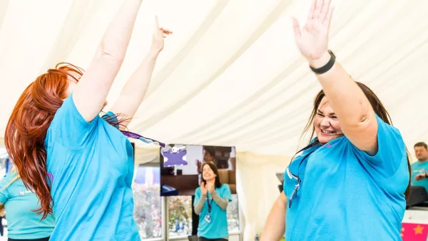 Treadmill challenge participants doing a hi-five